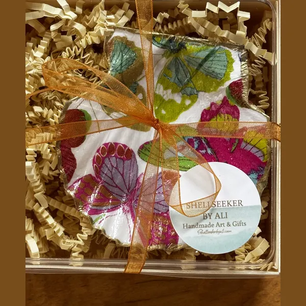 A shell dish decorated with jewel-toned butterflies, gift-boxed.